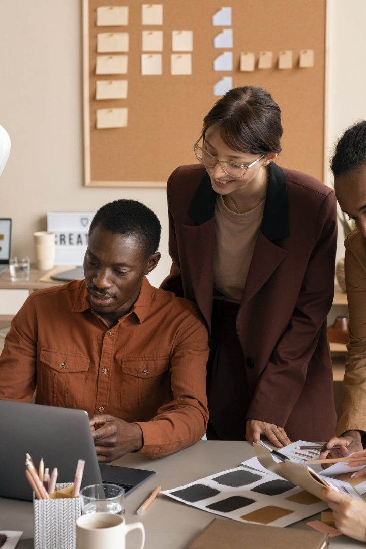 high-angle-smiley-colleagues-working-together (Large)